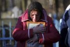 A relative reacts during a funeral ceremony of a Russian airliner crash victim in Saint Petersburg.