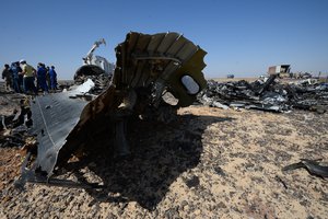 In this Russian Emergency Situations Ministry photo, made available on Monday, Nov. 2, 2015, Russian Emergency Ministry experts work at the crash site of a Russian passenger plane bound for St. Petersburg in Russia that crashed in Hassana, Egypt's Sinai Peninsula, on Monday, Nov. 2, 2015.