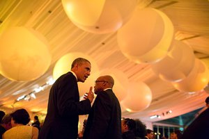 File - President Barack Obama talks with President Jacob Zuma of South Africa during the U.S.-Africa Leaders Summit dinner on the South Lawn of the White House, Aug. 5, 2014.