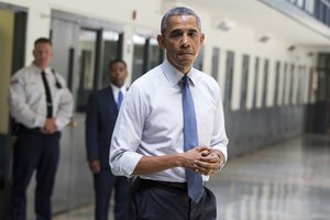 President Barack Obama pauses as he speaks at the El Reno Federal Correctional Institution in El Reno, Okla., Thursday, July 16, 2015.