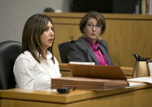 Virginia Vasquez, judicial aide to Judge Julie Kocurek, testifies during Texas Gov. Rick Perry's pretrial hearing on felony abuse of power charges in the 390th District Court at the Blackwell-Thurman Criminal Justice Center, Thursday, Nov. 6, 2014, in Austin, Texas.