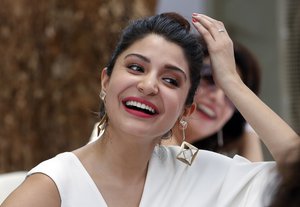 Bollywood actress Anushka Sharma smiles during the song launch of the upcoming movie ‘Dil Dhadakne Do’ in Mumbai, India, Sunday, May 3, 2015.