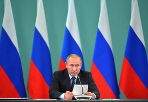 Russian President Vladimir Putin speaks during his late-night meeting with the heads of Russia's sports federations in the Black Sea resort of Sochi, Russia, Wednesday, Nov. 11, 2015.