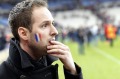 A French supporter reacts after going onto the pitch of the Stade de France stadium at the end of the international friendly soccer match between France and Germany.