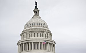 The Capitol dome is seen as automatic spending cuts are set to take effect on March 1, in Washington, Tuesday, Feb. 26, 2013.