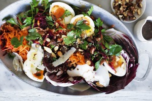 Soft-boiled eggs with beetroot, carrot and parsley salad.