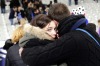 A supporter comforts a friend at the Stade de France.