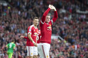 Manchester United's Wayne Rooney celebrates after scoring during the English Premier League soccer match between Manchester United and Sunderland at Old Trafford Stadium