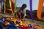 A member of the LGBT (Lesbian, Gay, Bi-sexual and Transgender) community has wit a colour ribbon during the Rainbow Carnival in Kolkata on December 9, 2012. The day long carnival was organised to show solidarity for the cause and to raise voices for equal rights and against social discrimination