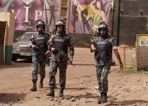 File - In this file photo taken on Saturday, March 7, 2015, armed forces provide security following an attack in Bamako, Mali.