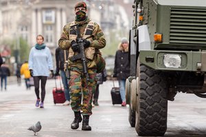 A Belgian Army soldier patrols on a main boulevard in Brussels, Sunday, Nov. 22, 2015.