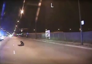 File - In this Oct. 20, 2014 frame from dash-cam video provided by Chicago Police Department, Laquan McDonald falls to the ground after being shot by officer Jason Van Dyke in Chicago. Van Dyke, who shot McDonald 16 times, was charged with first-degree murder Tuesday, Nov. 24, 2015.