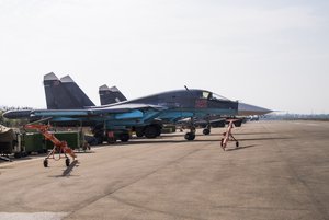 Two Russian Su-30 fighter jet parked at Hemeimeem airbase, Syria, Thursday, Oct. 22, 2015.