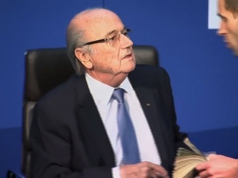 Man Throws Stack of Cash at FIFA's Sepp Blatter