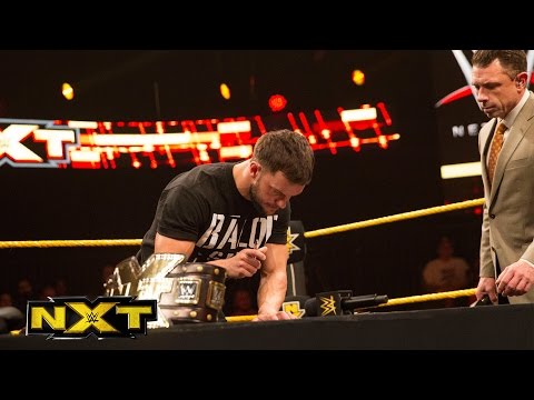 Finn Bálor and Samoa Joe sign the contract for TakeOver: London: WWE NXT, Nov. 25, 2015