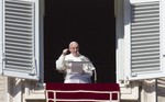 Pope Francis delivers the Angelus noon prayer from his studio window overlooking St. Peter's Square at the Vatican, Sunday, Nov. 22, 2015.