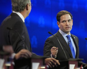 Marco Rubio, right, and Jeb Bush, argue a point during the CNBC Republican presidential debate at the University of Colorado, Wednesday, Oct. 28, 2015, in Boulder, Colo.