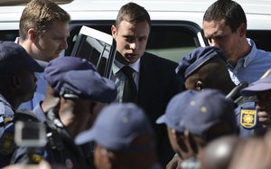 File - Oscar Pistorius, arrives outside the court in Pretoria, South Africa, Tuesday, Oct. 21, 2014.