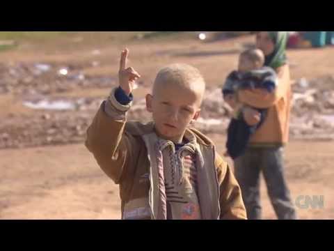 Scavenging for food, Syrian children witness war