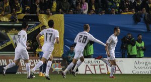 Real Madrid's Cherishev, right, celebrates after scoring against Cadiz during a Copa del Rey soccer match between Cadiz and Real Madrid at the Ramon de Carranza stadium in Cadiz, Spain, Wednesday Dec. 2, 2015.