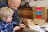 Caspar and Darryl Thompson construct a wooden handmade toy kit for Buildme Toys.