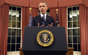 President Barack Obama addresses the nation from the Oval Office at the White House in Washington, Sunday night, Dec. 6, 2016.