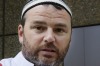 Cronulla memorial organiser Nick Folkes at court on Wednesday dressed in a mock Islamic outfit.