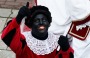 GROU, NETHERLANDS - FEBRUARY 14:  People line the streets near the pier as Sint Piter, named after the patron saint of fishermen Saint Peter, and Zwarte Piet (or Black Pete) arrive much to the delight of locals on February 14, 2015 in Grou, Netherlands. Grou residents celebrate their own version of Sinterklaas, or Santa Claus, every year.  (Photo by Dean Mouhtaropoulos/Getty Images)