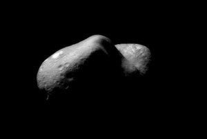 File - This picture of Eros, taken on February 14, 2001, shows the view looking from one end of the asteroid across the gouge on its underside and toward the opposite end.