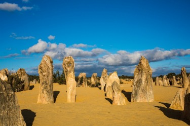 Pinnacles National Park, known as Nambung to the traditional owners, is a mysterious place unexplained by science. Fields of rocks of unknown origin stand vertically out of the sand dunes like fossilised sentinels from a forgotten history.