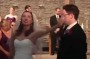 A couple dances down the aisle to Journey's Don't Stop Believin'.