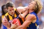 MELBOURNE, AUSTRALIA - OCTOBER 03: Isaac Smith of the Hawks is tackled by Matt Priddis of the Eagles  during the 2015 AFL Grand Final match between the Hawthorn Hawks and the West Coast Eagles at Melbourne Cricket Ground on October 3, 2015 in Melbourne, Australia.  (Photo by Quinn Rooney/Getty Images)