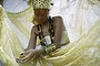 ITABORAI, BRAZIL - DECEMBER 13:  A worshipper is dressed as a female deity during a Candomble ceremony honoring goddesses Iemanja and Oxum on December 13, 2015 in Itaborai, Brazil. Candomble is an Afro-Brazilian religion whose practitioners sometimes fall into trances during ceremonies believing they have become possessed by gods, or orixas. The roots of the Candomble religion came to Brazil via African slaves and eventually incorporated some elements of Catholicism. Afro-Brazilian religions generally refer to Iemanja as goddess of the sea and Oxum as goddess of rivers, lakes and waterfalls, or fresh water.  (Photo by Mario Tama/Getty Images)