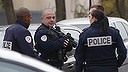 Police officers patrol near a pre-school, after a masked assailant with a box-cutter and scissors who mentioned the Islamic State group attacked a teacher, Monday, Dec.14, 2015 in Paris suburb Aubervilliers. The assailant remains at large, and the motive for the attack is unclear, authorities said. (AP Photo/Michel Euler)