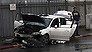 Israeli police examine a car used in a vehicular attack in Jerusalem Monday, Dec. 14, 2015. A Palestinian rammed his car into a bus station wounding nine people before he was shot and killed by bystanders, police said. (AP Photo/Mahmoud Illean)