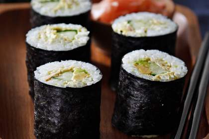 Tuna, avocado and cucumber sushi hand rolls.