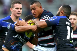 Going global: Sio Siua Taukeiaho of the Roosters is tackled by Tyrone Ranuku Phillips of the Bulldogs during the Auckland Nines earlier this year.