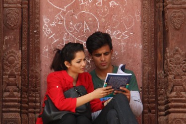 Kathmandu, Nepal, March 2014. These young people at a temple in the durbar were unaware of my interest and I was lucky to get this shot with a 300ml lens. As a teacher who constantly encouraged my students to read I imagined they were students looking at a new text book. A year later the durbar was badly damaged in the earthquake and I often wonder if they are safe. I'm going back next year so will take prints and try to find them.