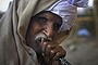 A Pakistani man enjoys hookah or waterpipe during a chilly evening in Islamabad, Pakistan, Tuesday, Dec. 15, 2015. (AP Photo/B.K. Bangash)