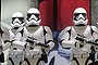 A man walks past a general store decorated with Star Wars' stormtrooper replicas lined up as part of Christmas decorations, in Paris, Tuesday, Dec. 15, 2015. (AP Photo/Christophe Ena)