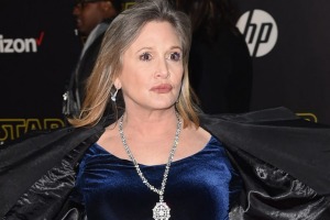 Carrie Fisher hamming it up on the red carpet at the premiere of Star Wars: The Force Awakens.