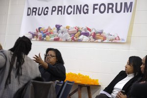 File - Stephanie Laster, second from left, is seen at the Atlanta Drug Pricing Forum on Monday, March 4, 2013, in Decatur, Ga.