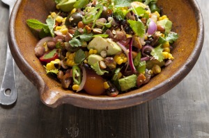 Grilled sweetcorn salad with black beans and pickled onion. 