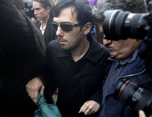 Martin Shkreli leaves the courthouse after his arraignment in New York, Thursday, Dec. 17, 2015.