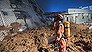 SHENZHEN, CHINA - DECEMBER 20:  Emergency services search a collapsed building after a landslide buried 22 buildings on December 20, 2015 in Shenzhen, China. Reports say at least 27 people are missing and 7 people have been rescued so far after a landslide hit China's southern province on Sunday.  (Photo by Lam Yik Fei/Getty Images)