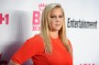 Comedian Amy Schumer says living with a parent with MS makes you focus on the "serious questions".
