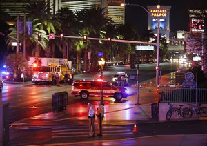 Police and emergency crews respond to the scene of a car accident along Las Vegas Boulevard, Sunday, Dec. 20, 2015, in Las Vegas.