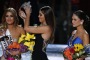 Former Miss Universe Paulina Vega, center, removes the crown from Miss Colombia Ariadna Gutierrez, left, before giving it to Miss Philippines Pia Alonzo Wurtzbach, right, at the Miss Universe pageant on Sunday, Dec. 20, 2015, in Las Vegas. Gutierrez was incorrectly named the winner before Wurtzbach was given the Miss Universe crown. (AP Photo/John Locher)