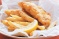 Crispy fish and chips with radish and coleslaw