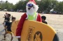 An Indonesian surf instructor dressed as Santa Claus at Kuta beach in Bali, Indonesia.